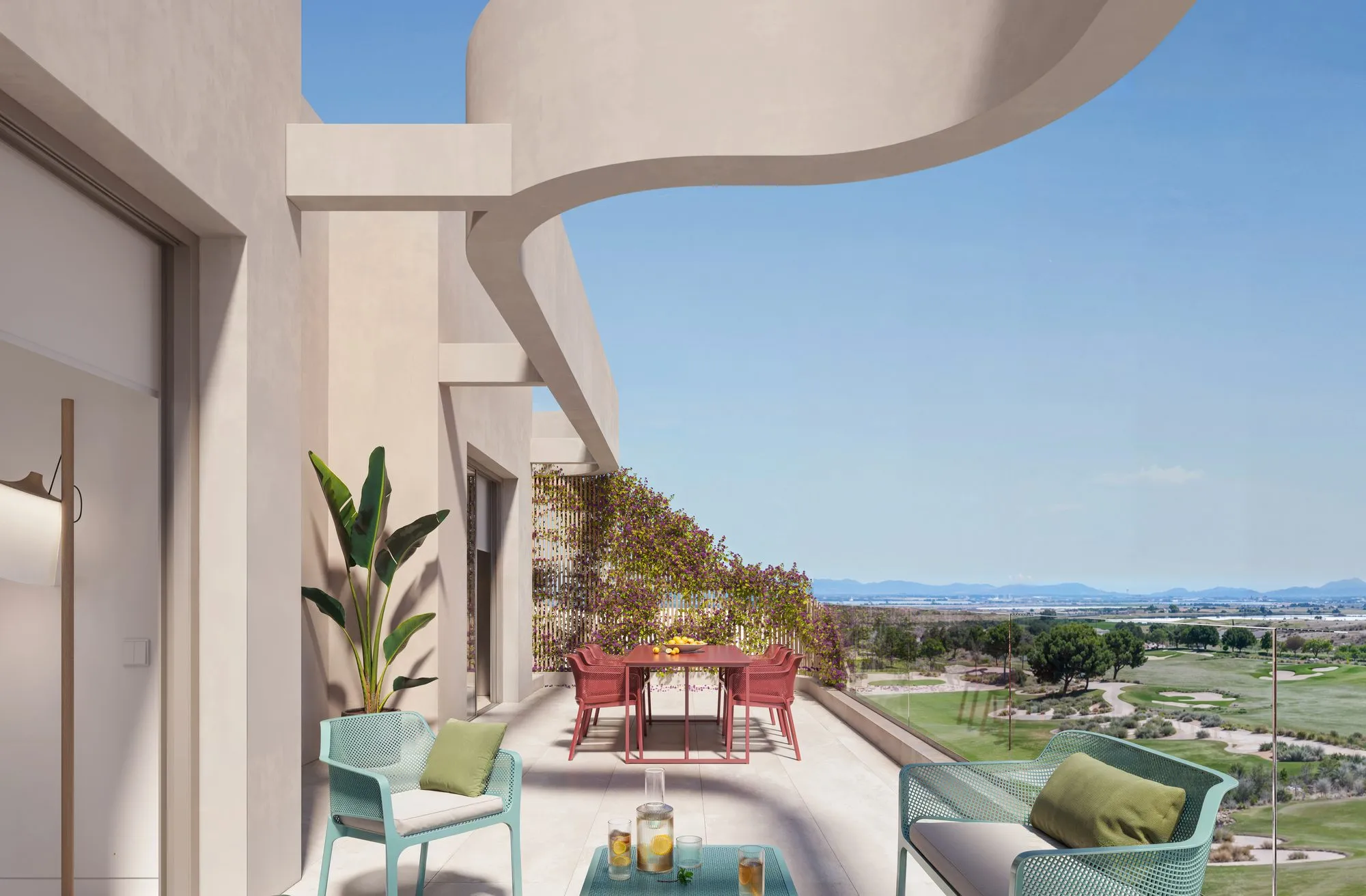 Render of an upper-floor apartment terrace under a curving white overhang, with turquoise chairs, a red dining set and views over the golf course