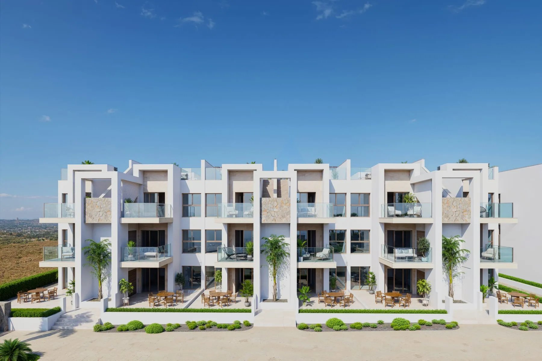 Fachada principal de AREAbeach VII con los jardines de planta baja