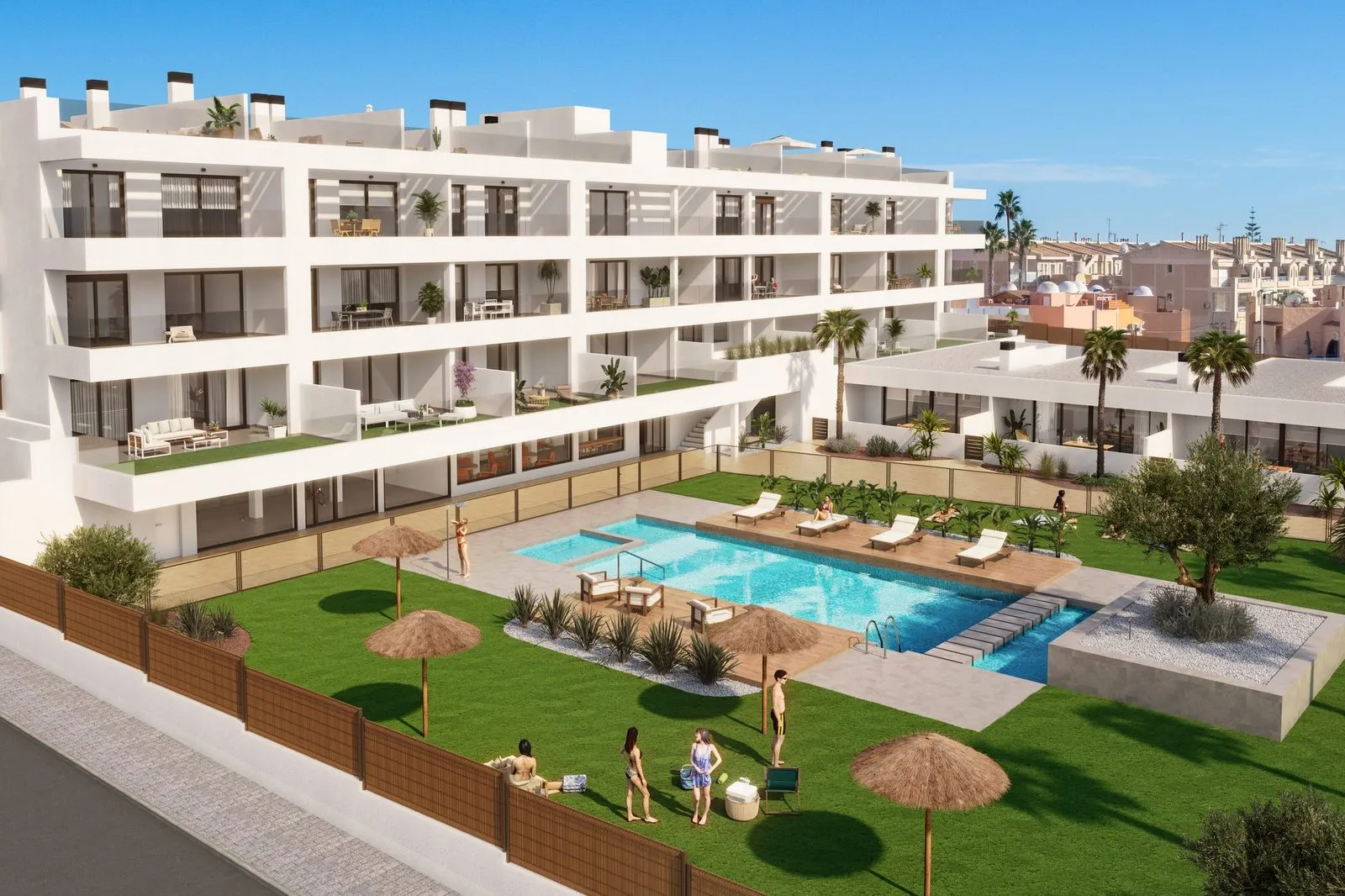 Aerial render of Almaia: the three-storey apartment building, the villas on the right and the pool with lawn, thatched parasols and bathers in the foreground