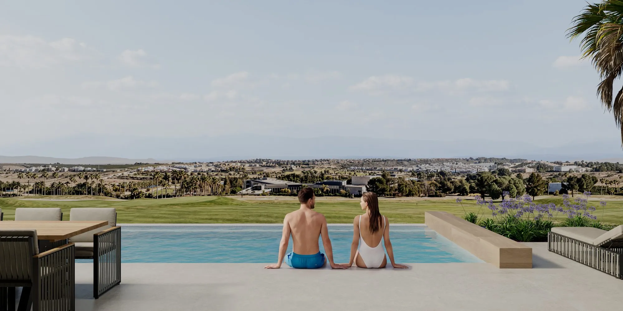 Render of a couple sitting on the edge of the infinity pool, looking out over the golf course and the plain