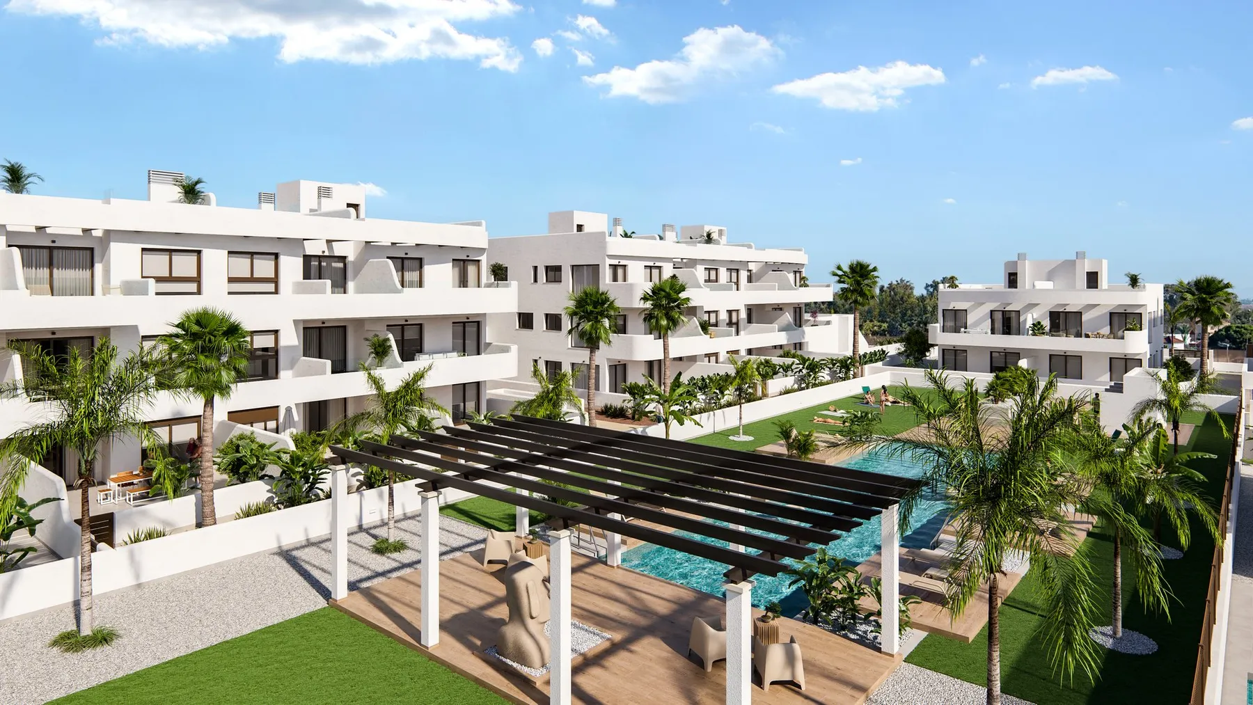 Impressie van de gemeenschappelijke ruimte met pergola, zwembad en appartementsgebouwen