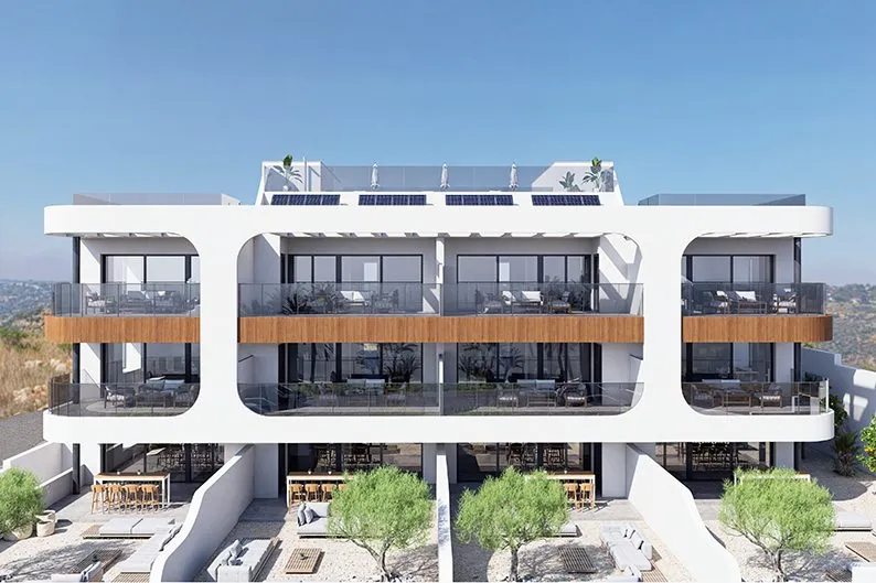 Render of Benisol III, a white three-storey building with a curved frame around the balconies, wood-effect bands and ground-floor terraces with olive trees